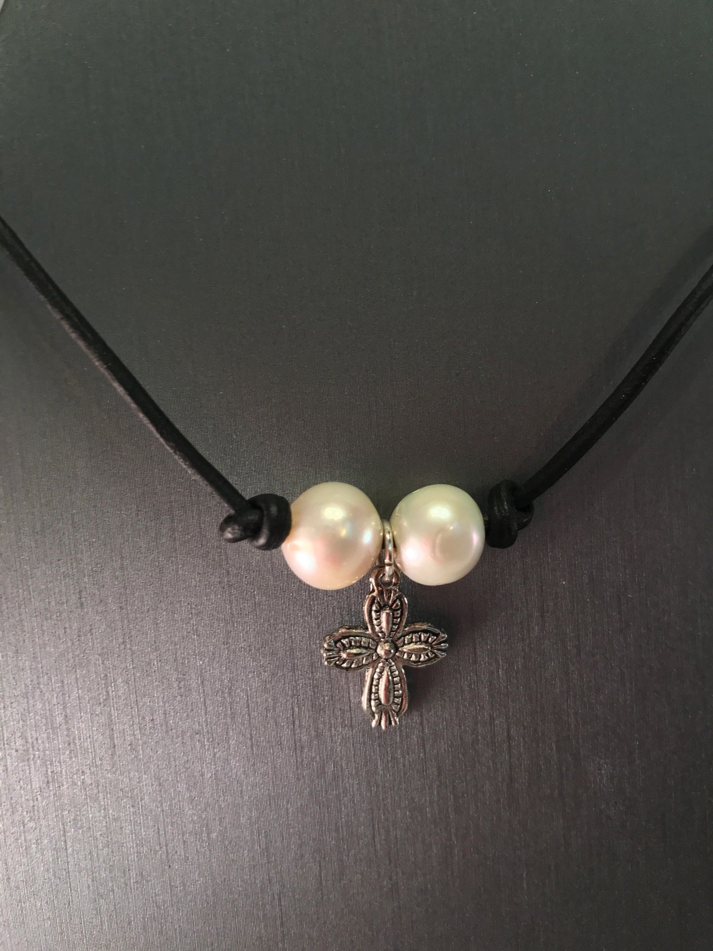 Double pearl cross choker on leather cord