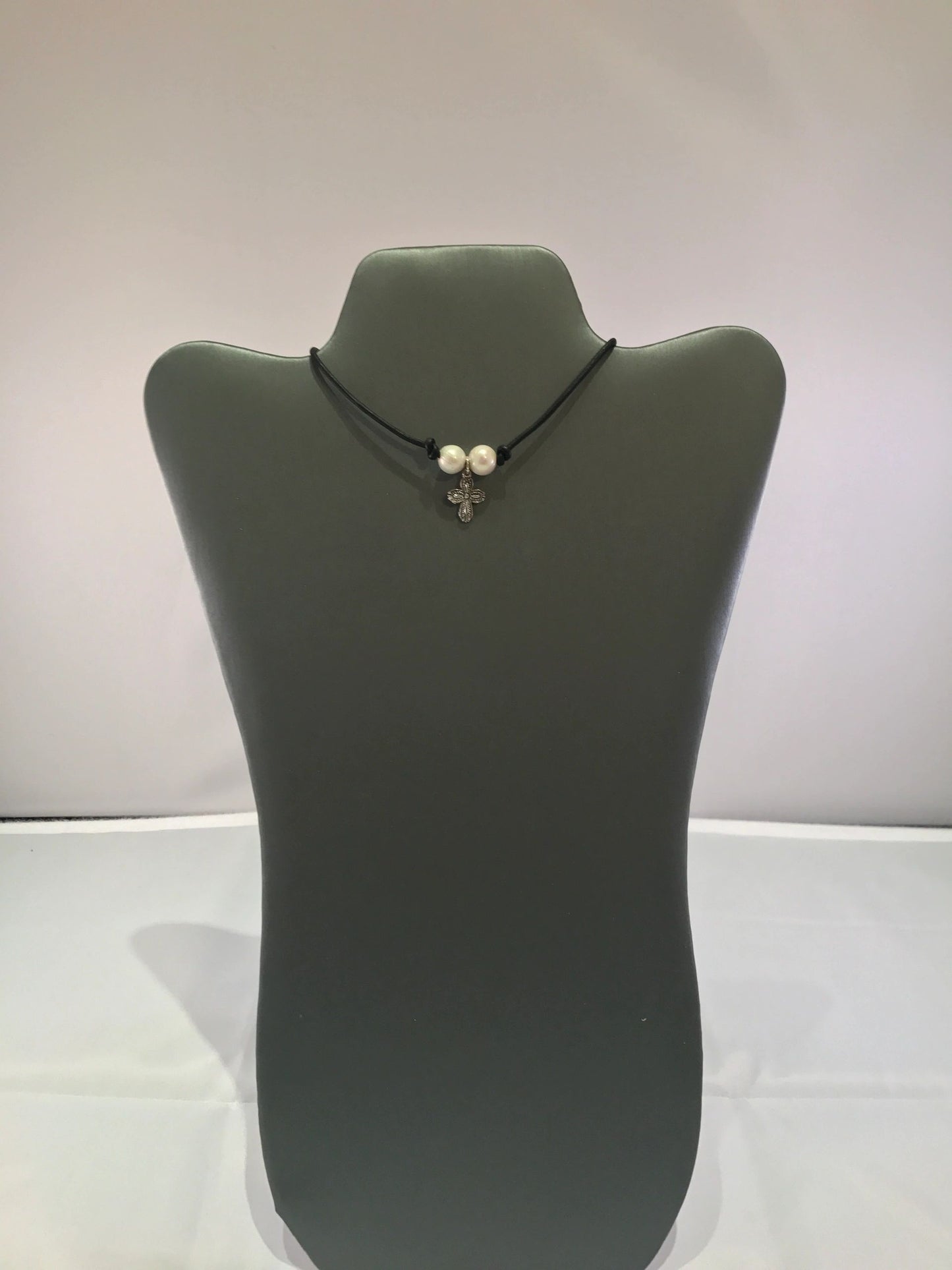 Double pearl cross choker on leather cord