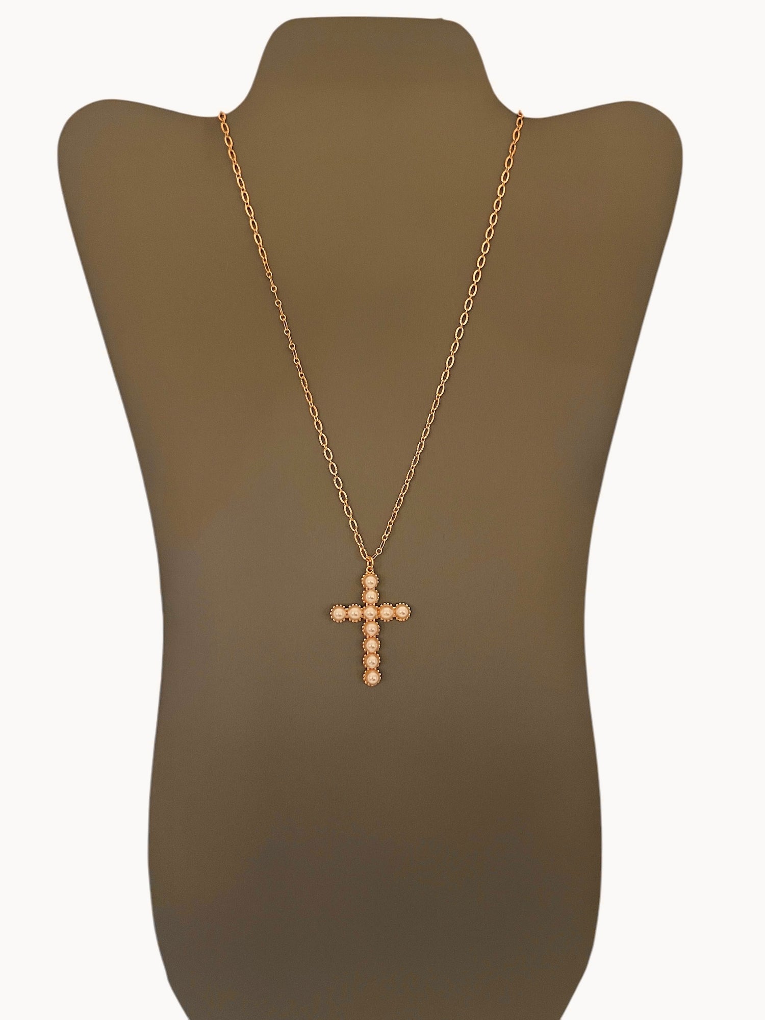 A Gold Pearl Cross Necklace displayed on a mannequin bust. The necklace features a gold-filled chain with a gold cross adorned with pearls.