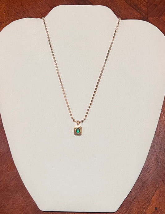 Emerald green rectangular pendant necklace with gold chain
