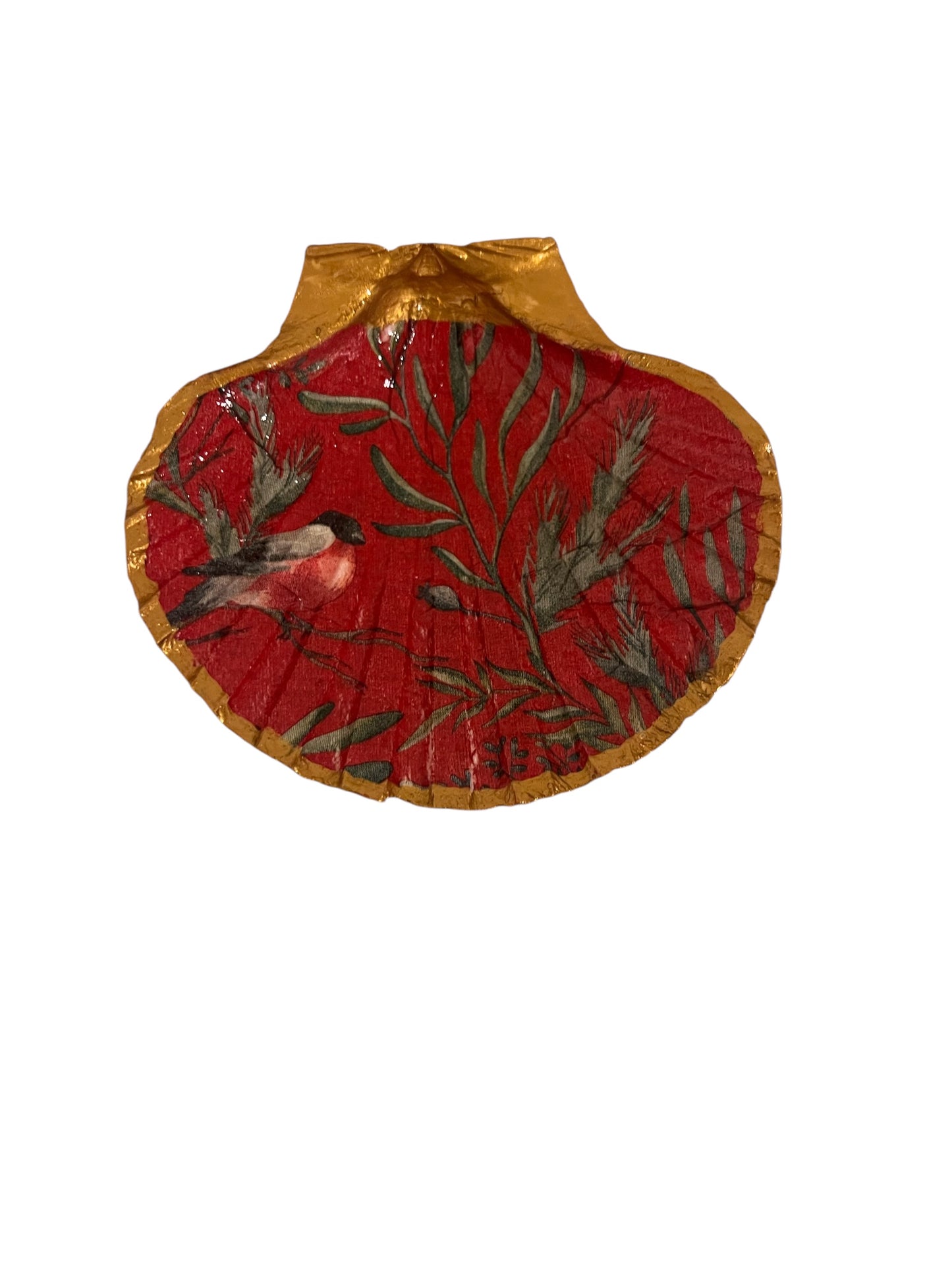 A red bird scallop shell with gold trim, used as a trinket holder.